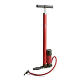 A red air pump featuring a hose, used for inflating tires or sports equipment.